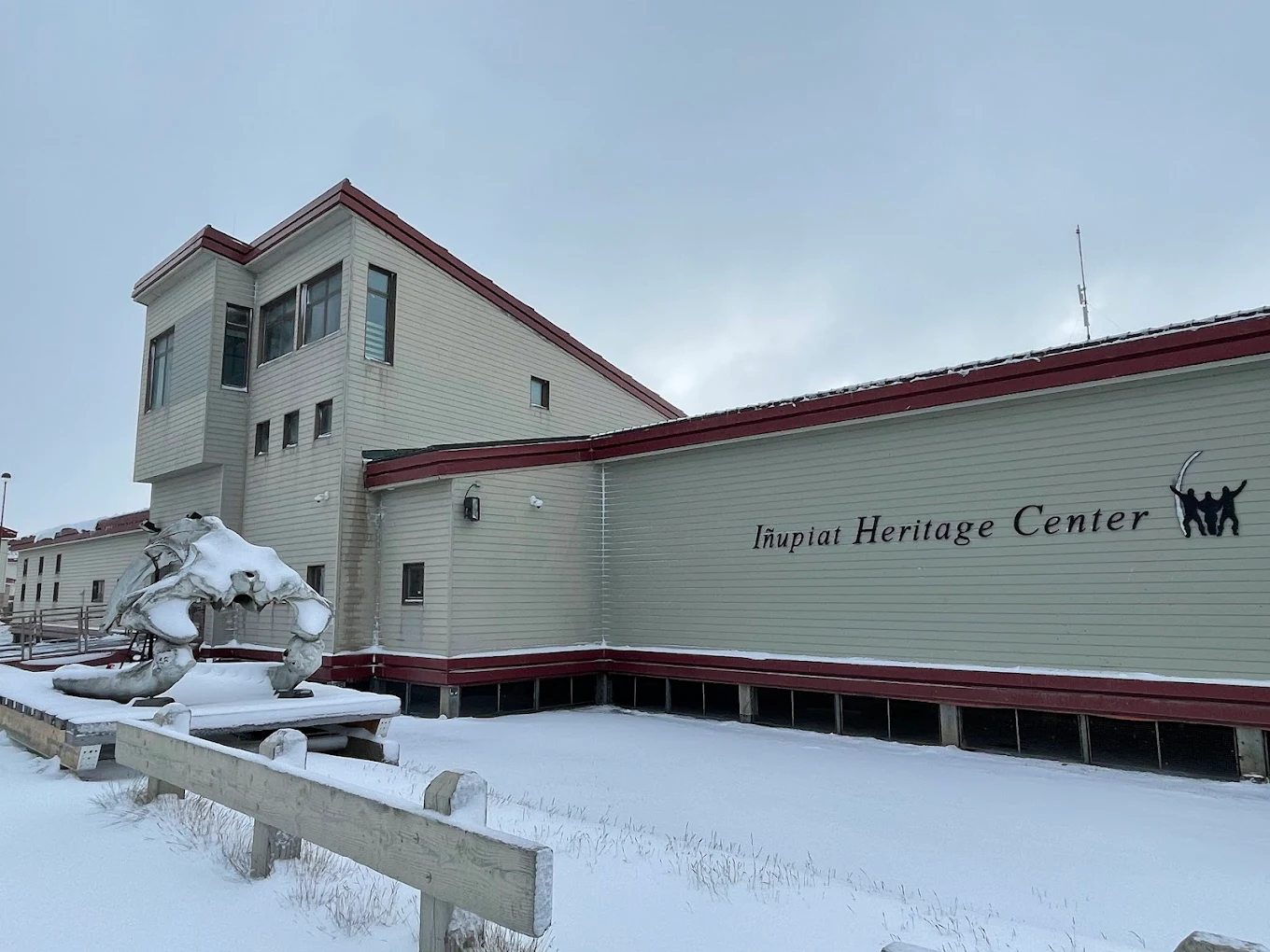 The Iñupiat Heritage Center museum building in Utqiaġvik, Alaska, covered in snow