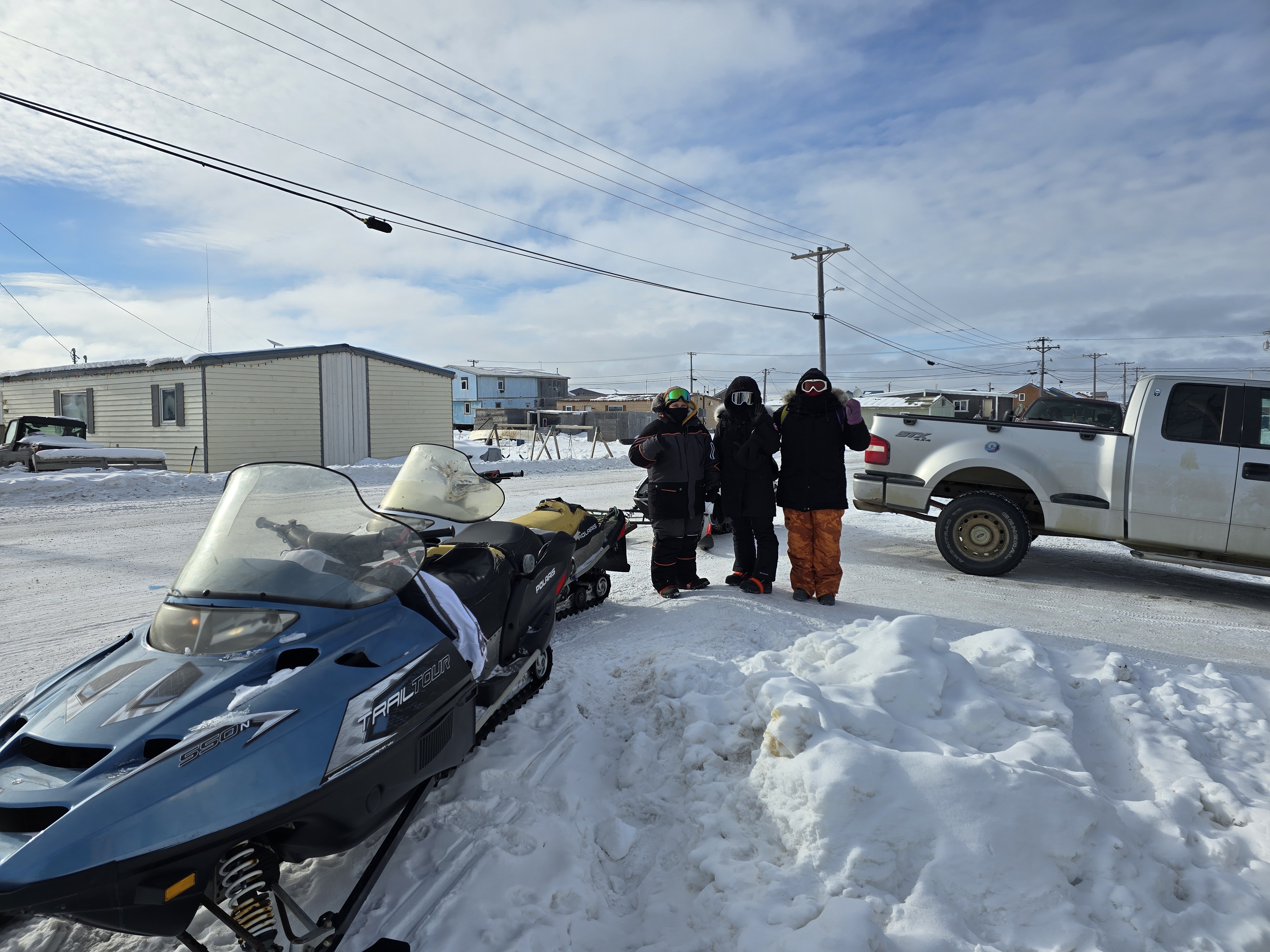 Guests standing at the edge of the Arctic in Utqiaġvik, Alaska — a Kiita Tours Point Barrow Arctic experience